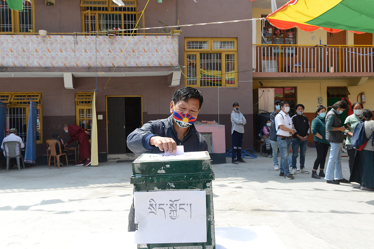 An exile Tibetan cast his vote to elect a new Sikyong, political leader, and 45 members of the Tibetan Parliament-in-exile at a polling station in McLeod Ganj, India, on 11 April 2021.
